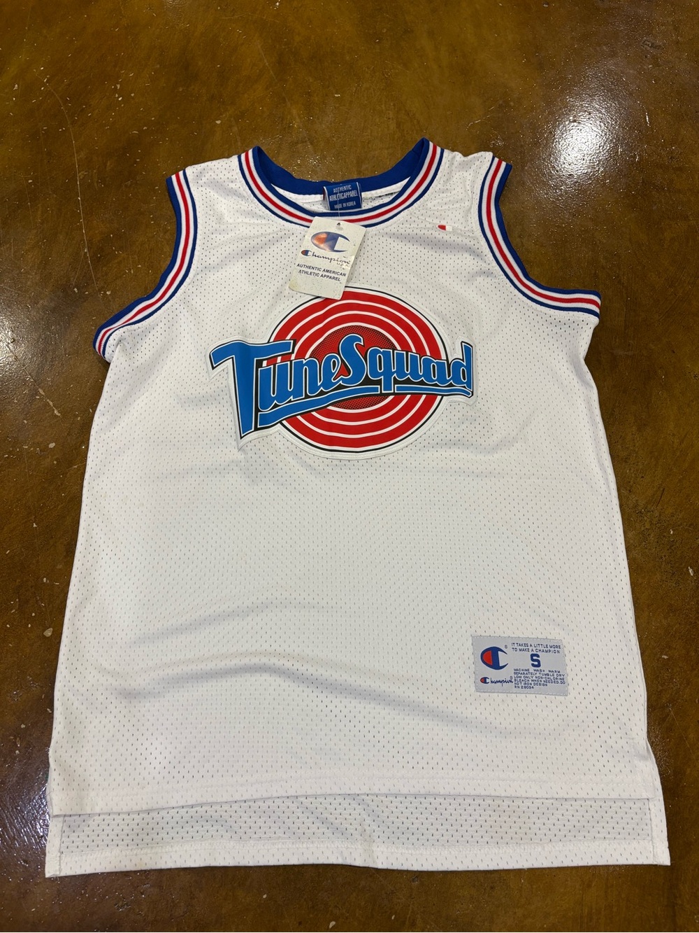 Champion White Tune Squad Kids Basketball Jersey with Red & Blue Logo